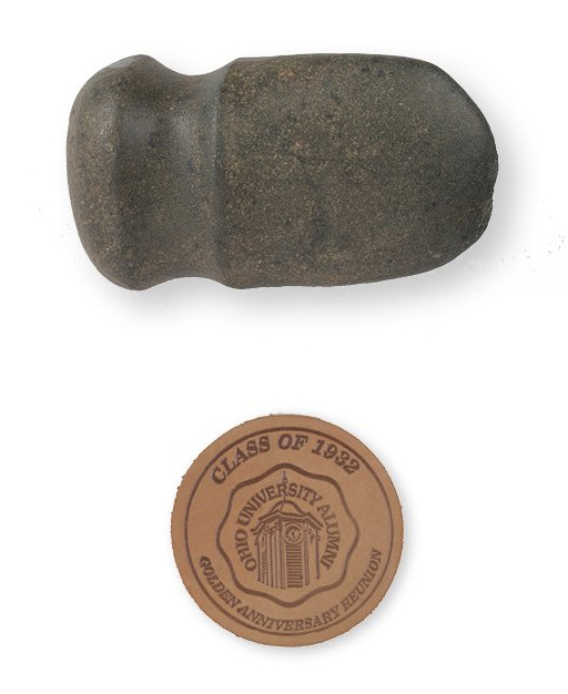 ABOVE: A ~5,000-year-old stone axe found in 1961, used by the Adena, probably to strip bark. BELOW: The class of 1932’s 50th reunion leather coaster giveaway, embossed with an OHIO Alumni Association logo. 