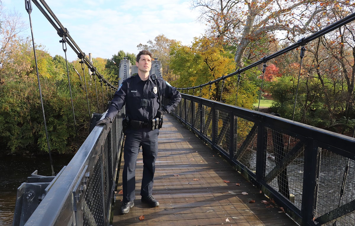 Officer Mike Regan, played by Nick Steen, stands on a bridge featured in the episode, "Jumper on High Plains Bridge," one of six new cinematic virtual reality (Cine-VR) trainings now available to law enforcement across the state of Ohio.