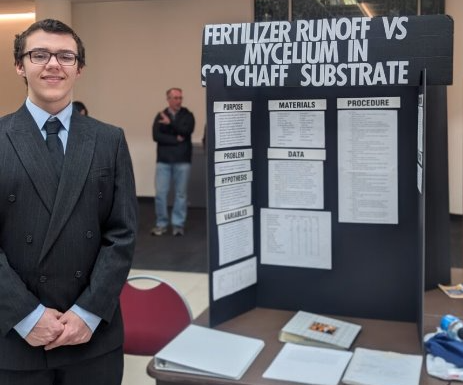 Robert Whittington is shown with his project at District Science Day