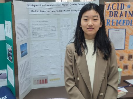 Xinrui Han is shown with her project at District Science Day