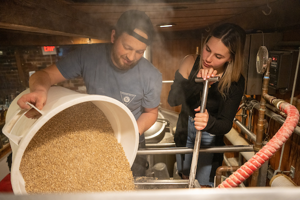 Jackie O's brewer Liam McDonald teaches a student the ways of the brewery.