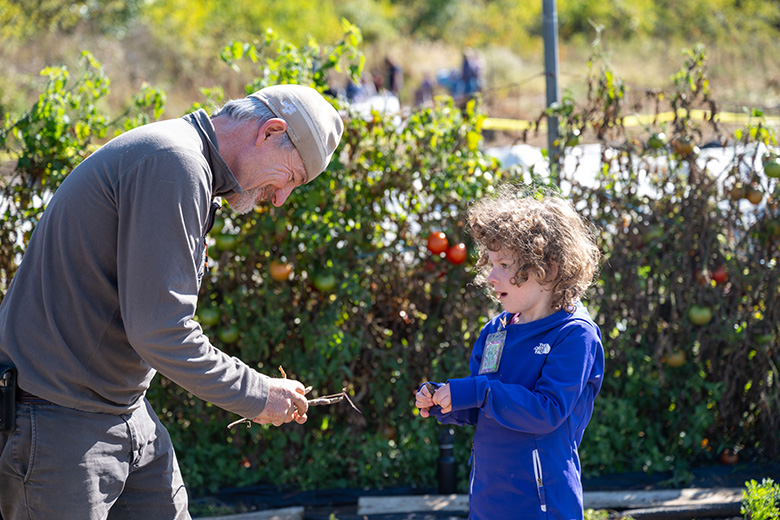 OHIO Student Farm Coordinator and professor Dr. David Rosenthal educates a student in the Sprouts program.