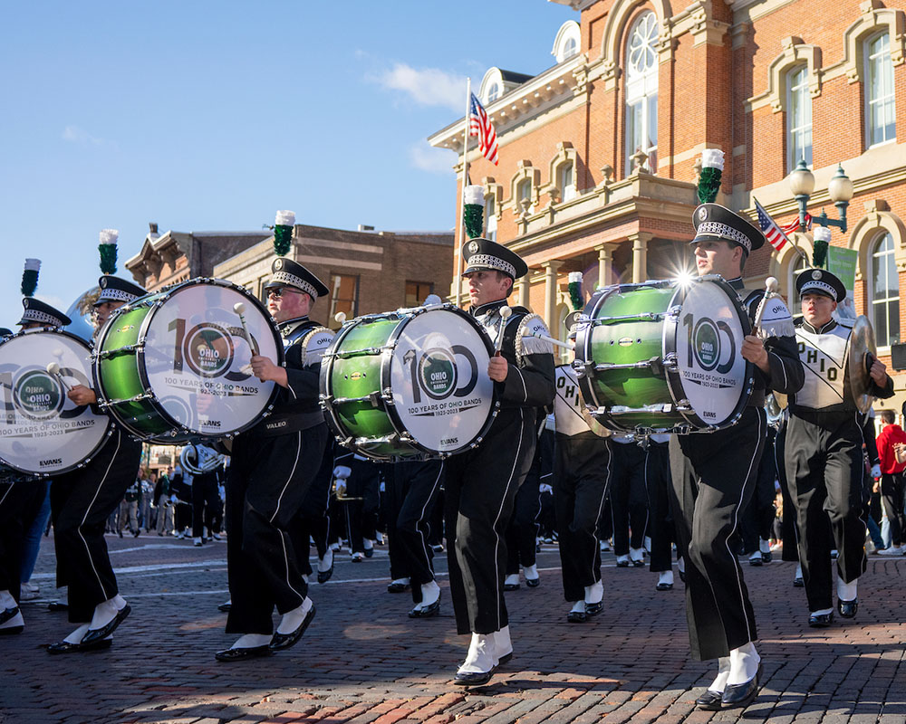 The Marching 110 drum line keeps the beat down Court Street during the Homecoming Parade