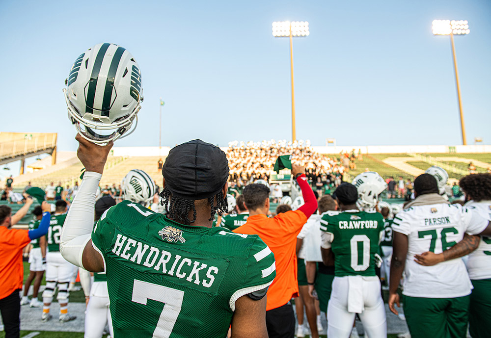 On Frank Solich Field, the roar of the crowd blends with the players' own cheers—an electric atmosphere as Bobcats come together for another historic matchup.