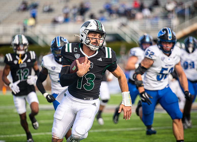 An OHIO football player runs with the football.