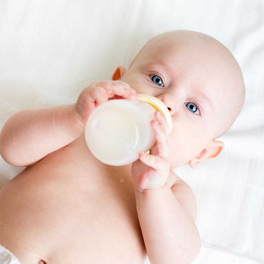 Baby feeding from a bottle