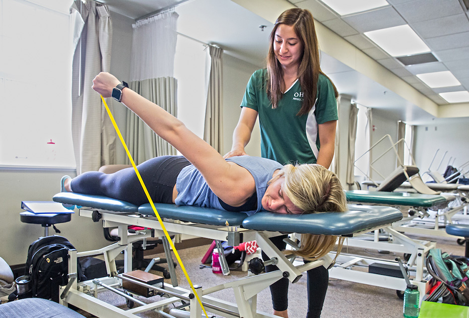 An Ohio University exercise physiologist works with a patient