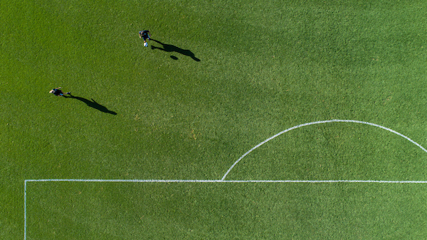 Aerial view of two players on a soccer field