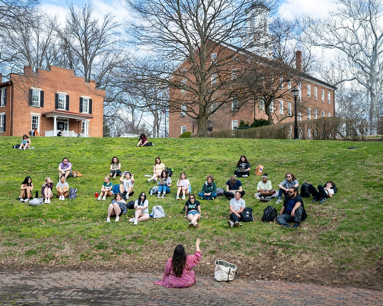 OHIO students listen to a professor teaching a class at the Scripps Amphitheater