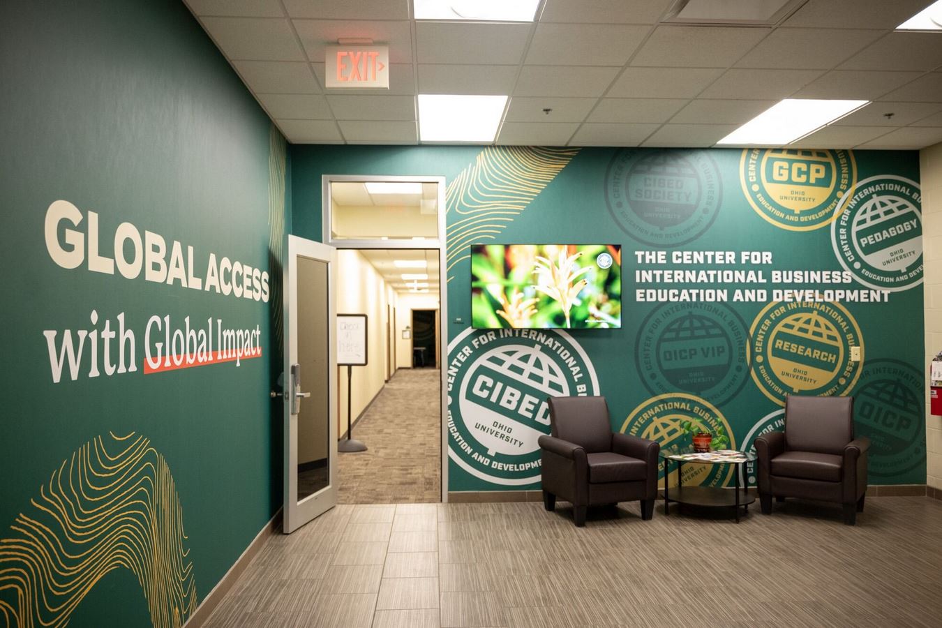 An interior shot of the Schey Sales Centre, this time facing an open doorway with more walls with text. One of them reads 