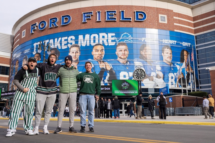 A group of OHIO fans pose outside Ford Field before the MAC championship game