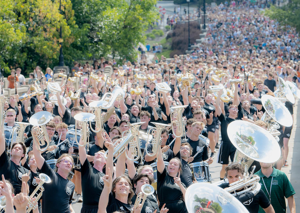 The Marching 110 leads a line of incoming students up Richland Avenue in Athens Ohio