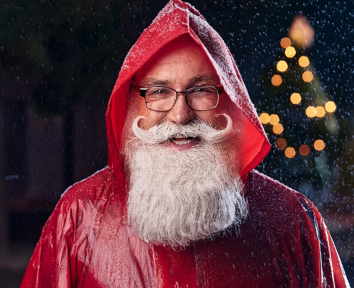 Santa Claus is shown wearing rain poncho in this illustration