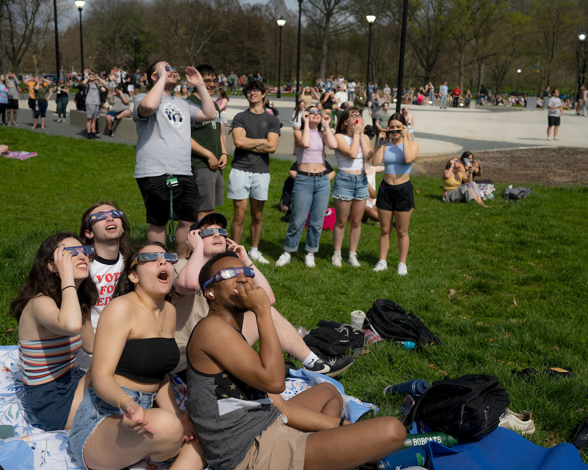 Students at Ohio University watch the 2024 solar eclipse on the Athens campus