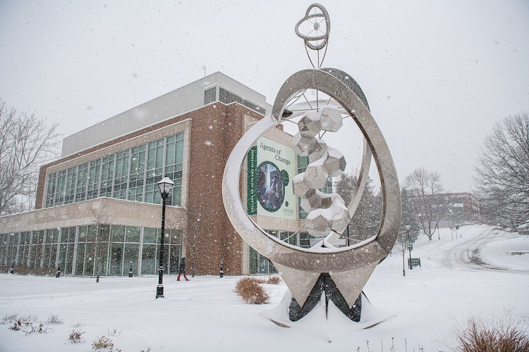 The Chemistry Building and an outdoor art piece is shown on a snowy day at Ohio University