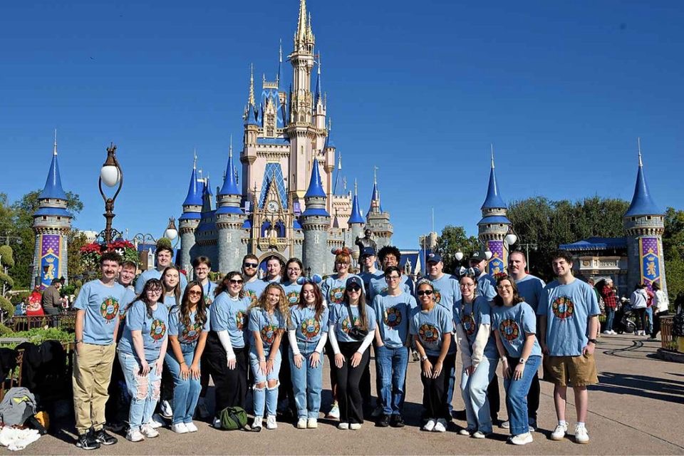 Students in front of Cinderella's castle at Disney