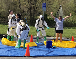 Collins Career Technical Center students undergo a mock “decontamination” as part of Friday’s “No Hazards Here” critical incident safety simulation, a capstone project in collaboration with Ohio University Southern.