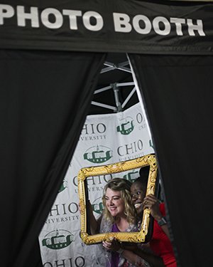Alumni leaders use a photo booth 