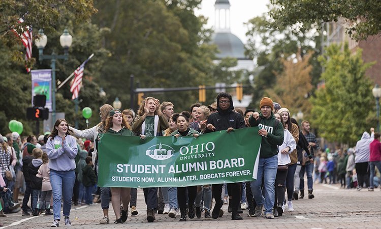 Members of Ohio University’s Student Alumni Board were one of nearly 100 individuals, OHIO organizations and local businesses who participated in the Homecoming tradition that beckons all Bobcats back to the bricks – the annual Homecoming Parade.