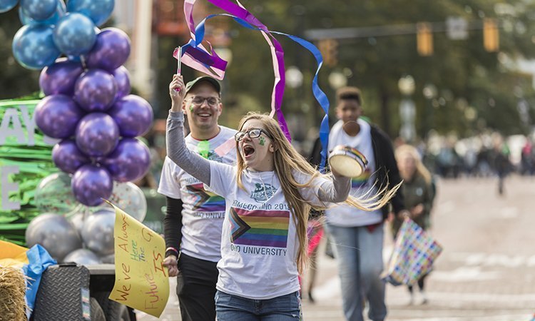 Staff, students and supporters from Ohio University’s LGBT Center show off their Bobcat pride at the 2019 Homecoming Parade and won first place for the best float.
