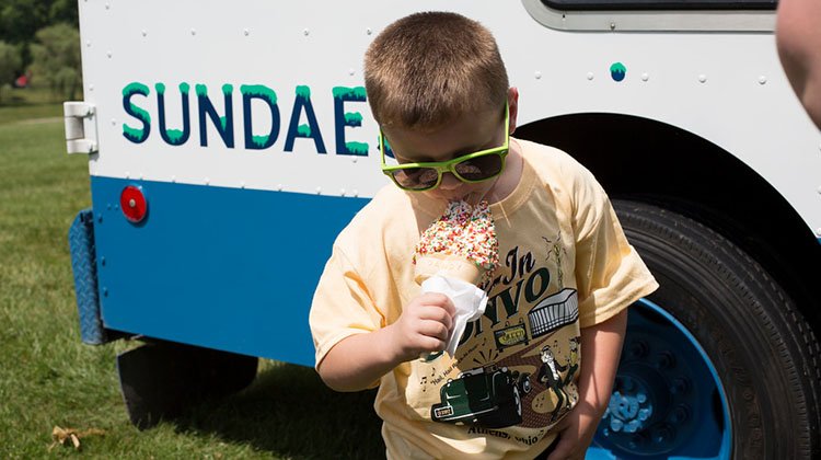 An On The Green Weekend attendee enjoys an ice cream cone.