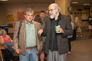 (From left) Bill Reader, a professor in the E.W. Scripps School of Journalism and chair of the University Library Committee, chats with Executive Vice President and Provost Chaden Djalali during Alden Library’s 50th birthday party.