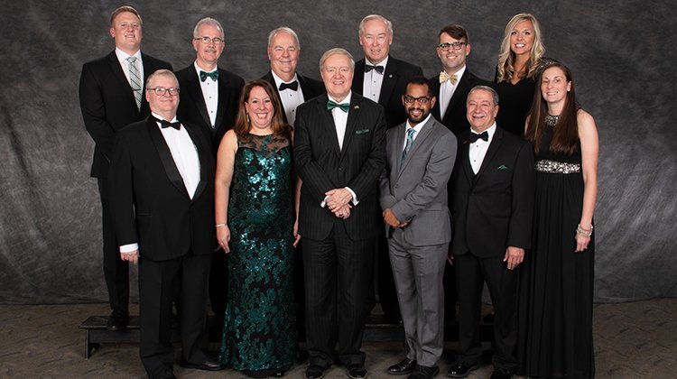 Ohio University President M. Duane Nellis (front center) is pictured with 2018 Alumni Awards recipients (front, from left) Mark D. West, Jennifer Jones Donatelli, Keith Hawkins, William “Erv” Ball and Tiffany Horvath, and (back row, from left) Marc Krauss, Ronald Burns, Peter Thompson, Glenn Corlett, Luke Frazier and Melissa Griffin.