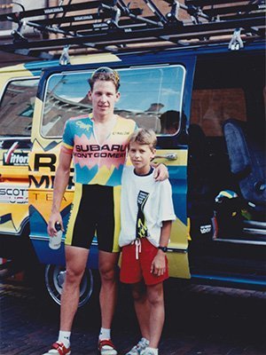 A young Daniel Brown, BS '02, MS '07, poses with renowned cyclist Lance Armstrong, who, along with Tour de France winner Greg LeMond, competed in the Athens Brick Criterium.