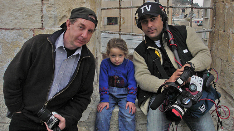 D. Thomas Hayes (far left), BGS ’77, a lecturer in the College of Fine Arts’ School of Film, is pictured while filming in Nablus, a city in the northern West Bank. Hayes was awarded $12,000 from the John C. Baker Fund to continue his work on a documentary that explores the lives of generations displaced by the Israeli-Palestinian conflict. 