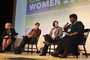 (From left) Laurie Lach, Jennifer Friel and Heather Lawrence-Benedict listen as Cynthia Calhoun addresses the audience during a panel discussion at the 13th annual Celebrate Women Conference. 