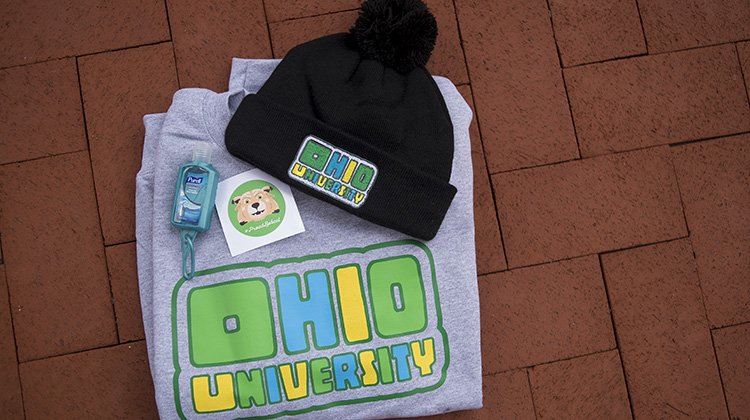 Pictured are some of the items available in the Fall 2018 Finals Week Survival Kit, including an OHIO-themed beanie, crew neck sweatshirt and Rufus decal.