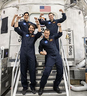 Bob Ferguson, BSME ’98, and his three NASA HERA XX crewmates celebrate at NASA’s Johnson Space Center after emerging from the mock spacecraft they were confined to during the research expedition.