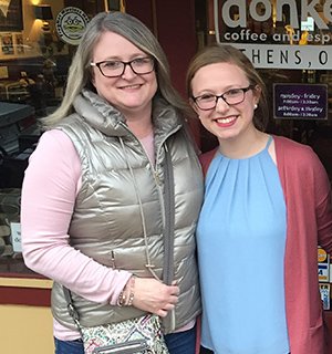 Legacy Scholarship recipient Josie Waugh and her mother, Charity Waugh, BFA '96, are pictured in front of Donkey Coffee in Athens, Ohio.