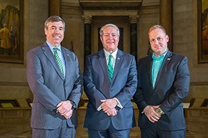 Ohio University alumnus Patrick Madden, President M. Duane Nellis and Vice President of University Advancement Nico Karagosian pose just outside the National Archives Vault, which houses the Declaration of Independence, U.S. Constitution, and Bill of Rights—the most closely protected pieces of paper on the planet. 