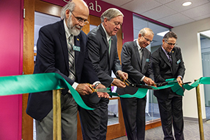 (From left) Ohio University Executive Vice President and Provost Chaden Djalali, President M. Duane Nellis, alumnus David Pidwell and Chair of the OHIO Board of Trustees David Scholl cut the ribbon at the October 2018 grand opening of CoLab.