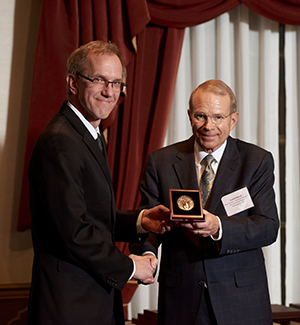 Joseph Shields, vice president for research and creative activity and dean of the Graduate College, presents the 2017 Konneker Medal for Commercialization and Entrepreneurship to David Pidwell. 