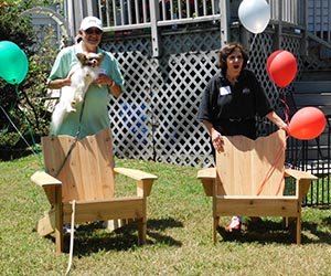 William and Sherry Rakatansky are pictured with the Ohio chairs given to them by those attending the 30th annual OSU-OHIO Picnic at Lake Norman.