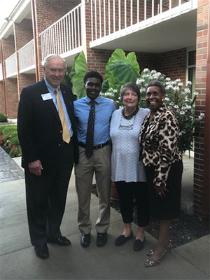 Pictured (from left) are Glenn Corlett, BBA ’65, former dean of the College of Business; Caleb Hall, BBA ’23; Bonnilyn Corlett; and Beatrice Selotlegeng, MBA ’08. Hall is the first recipient of the Beatrice Selotlegeng Scholarship, created by Glenn and Bonnilyn Corlett.