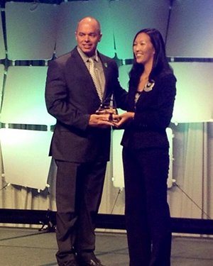 Timothy Law accepts the 2014 Mentor of the Year Award