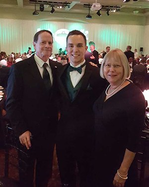 Kyle Triplett pictured at the Alumni Awards Gala with former interim OHIO President David Decutner and Lysa Burnier.