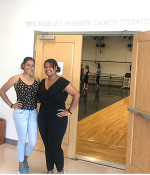 Wimmer/Patterson Urban Dance Award recipients Cierra Hill, BFA ’20, and Jillian Lewis, BFA ’22, are seen outside of Putnam Hall’s Shirley Wimmer Dance Theater. Both the theater and the financial assistance the students are receiving through the award established by Darlene Patterson Spencer, BA ’69, are named in honor of the founder of Ohio University’s School of Dance. 