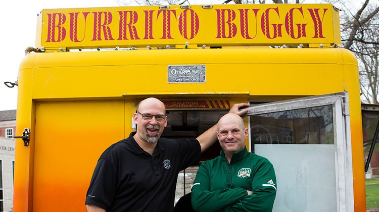 Eli Flournoy and Jim Stricklin grin in front of the one-and-only Buritto Buggy