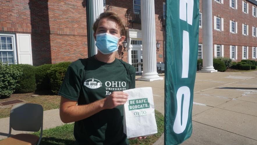 Student Nick Nolan picked up his Be Safe Bobcats bag during the Bobcat Blitz event at Ohio University Eastern during fall semester 2020. 