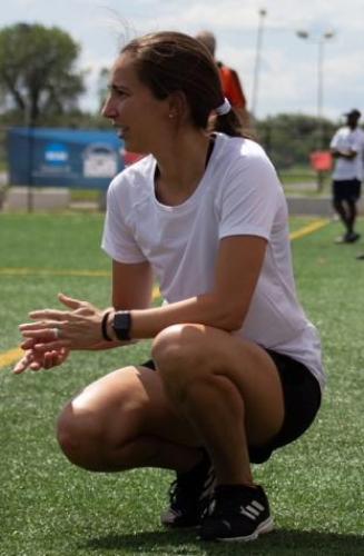 Stephanie Savino actively coaching on a soccer field