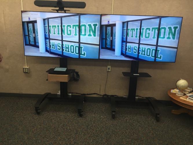 Video displays in a rally room at Huntington High School