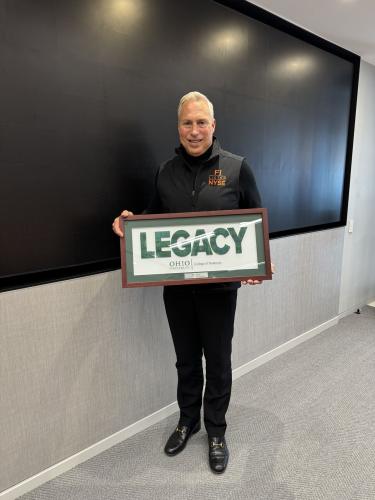 Tony Marino holds the Legacy Award