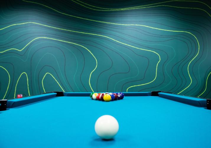 A pool table is shown in the new student engagement space in the Baker University Center