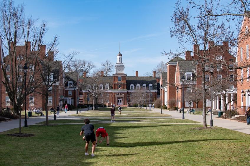 OHIO students relax and play football on the West Green