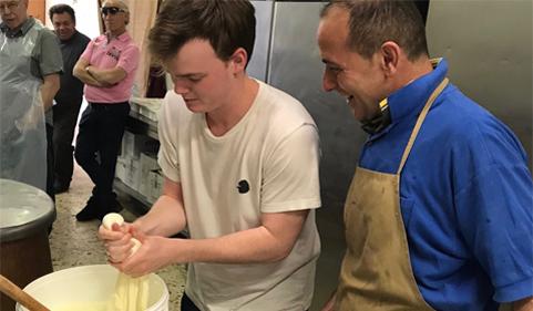 Gennaro directs Jack Conrath-Sweeney as he makes mozzarella balls from the stretched curds.