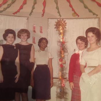 Dr. Michele Curtis Penick, BSED ’66, (center) is pictured with fellow Ohio University students inside Lindley Hall, where she resided as an OHIO undergraduate.